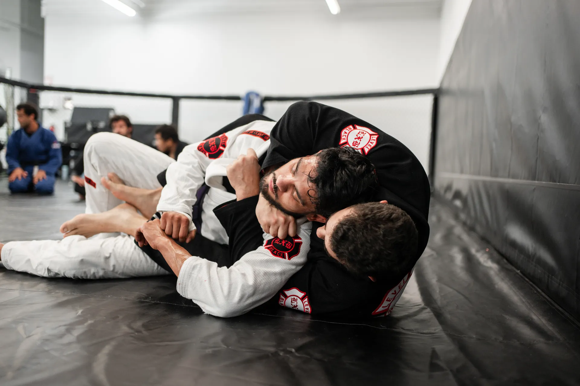 Brazilian Jiu-Jitsu technique detail during class at Hidden Gym Richardson