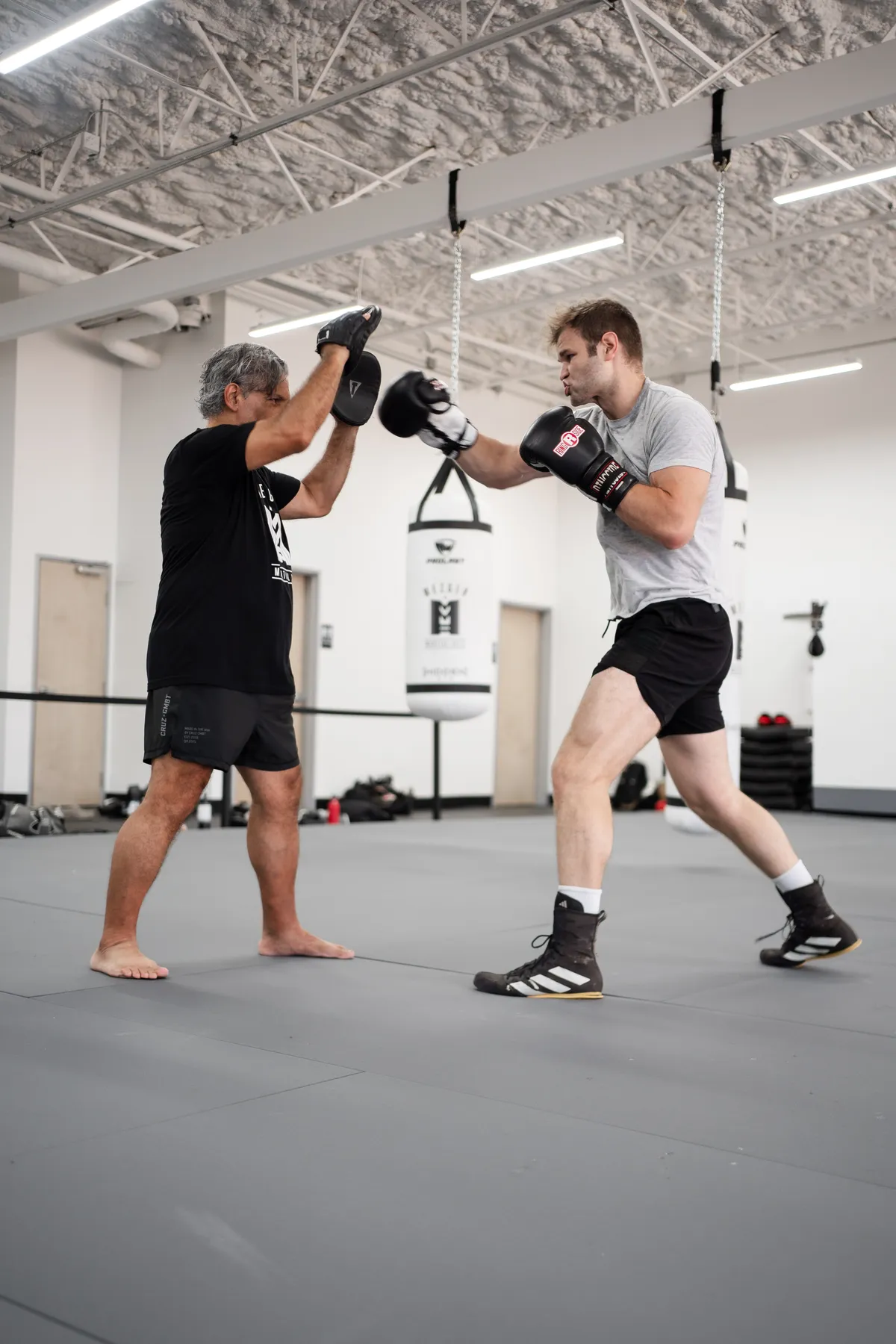 Boxing pad work at Mezger Martial Arts