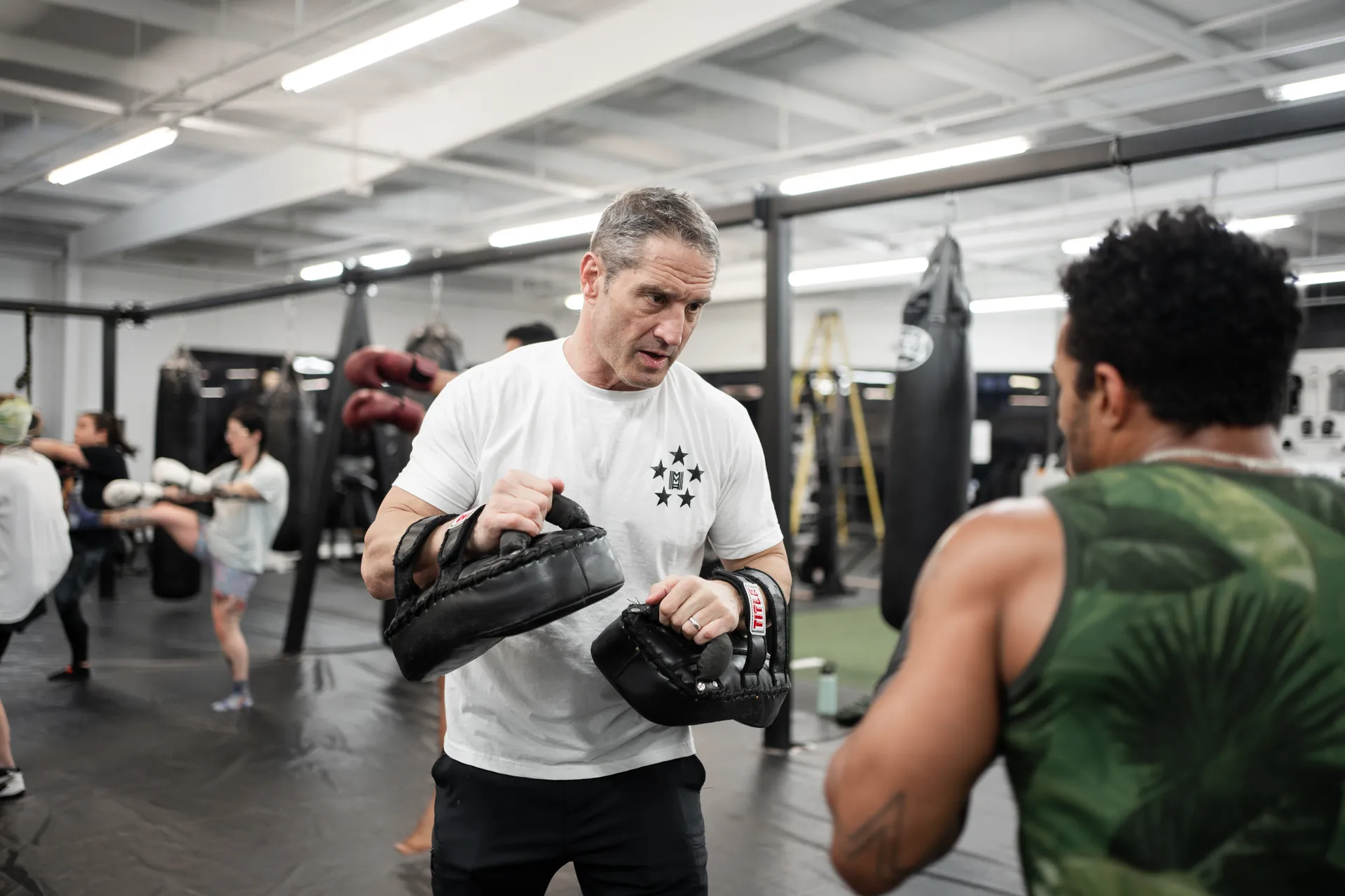 One-on-one pad coaching at Mezger Martial Arts